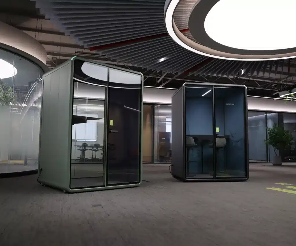 two ZUM model m soundproof work pod with two different furniture.
